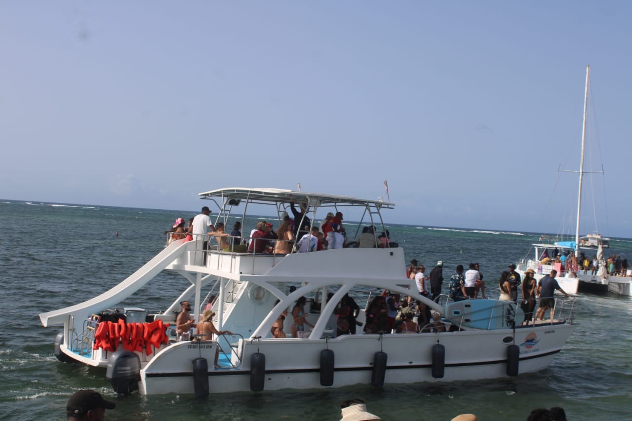 Two-level excursion boat carrying guests along the coast