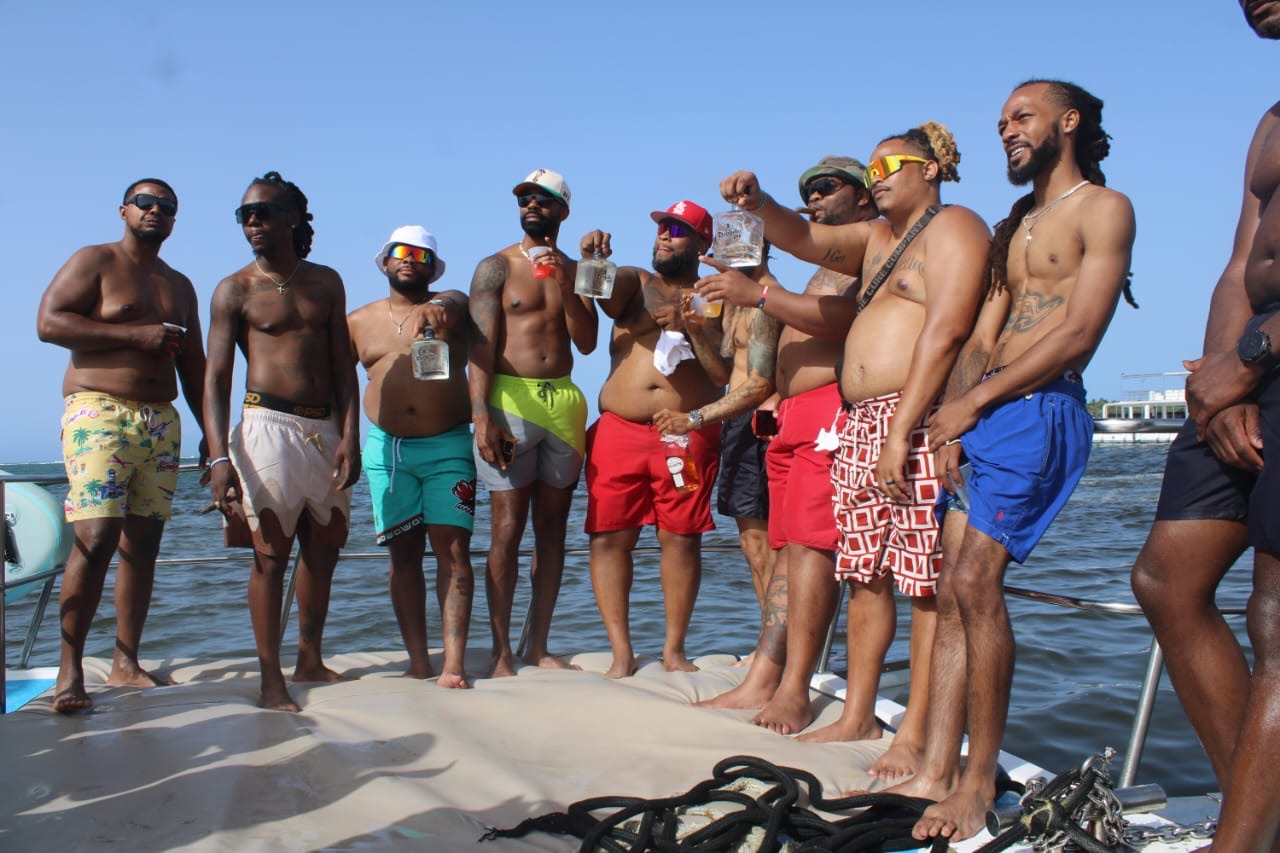 Friends raising drinks during a private boat celebration