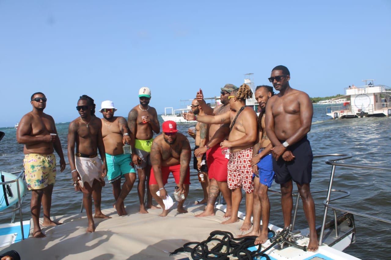 Private group posing together on a boat in Punta Cana