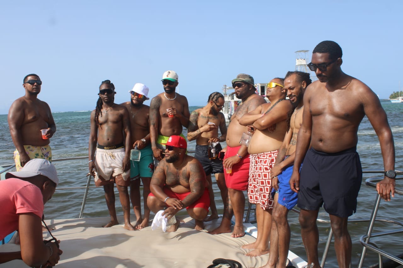 Group of friends gathered on the bow of a private boat