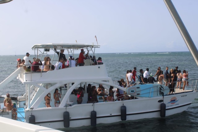 Two-level excursion boat cruising off the Punta Cana coast